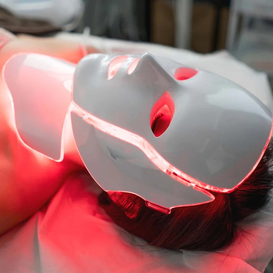 Red LED light therapy mask in use